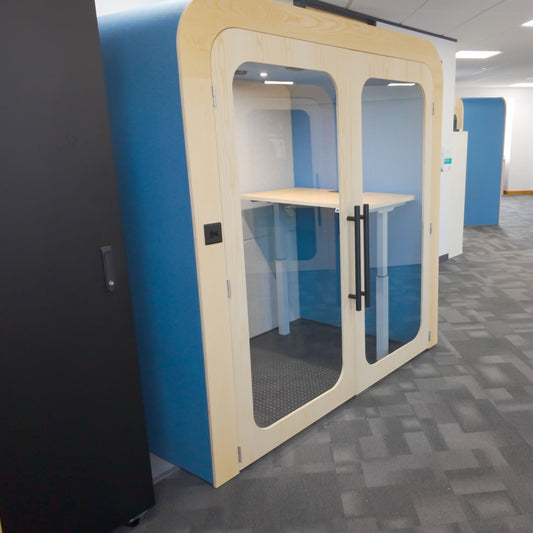 Modern office interior with blue and beige partition walls.
