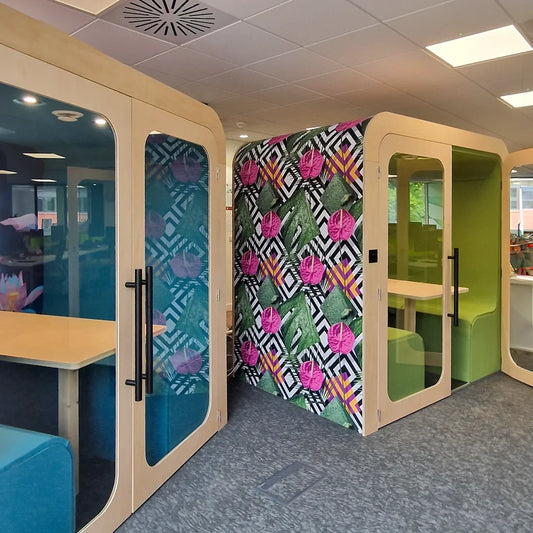 Bespoke Dapapod office pods with patterned exterior finishes and blue and green interiors