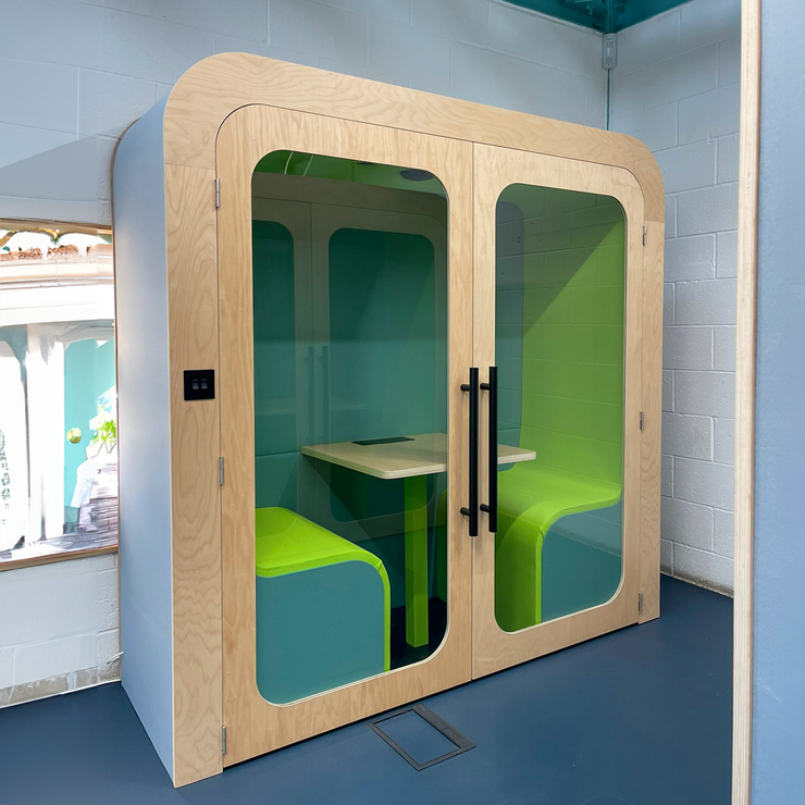 Dapapod acoustic meeting booth with lime and teal wool interior