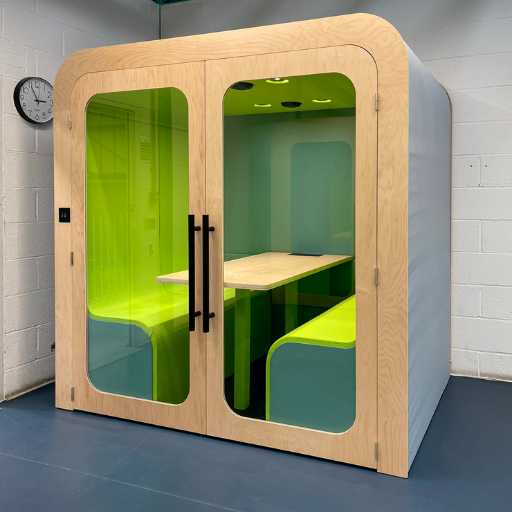 Dapapod acoustic meeting booth with lime green interior and birch frame