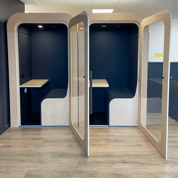 Pair of Dapapod single office pods with desks and navy interiors
